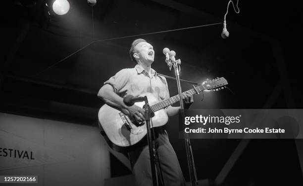 Pete Seeger at Newport Folk Festival 7-28-63.