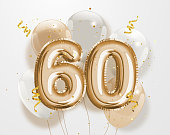 Happy 60th birthday gold foil balloon greeting background.