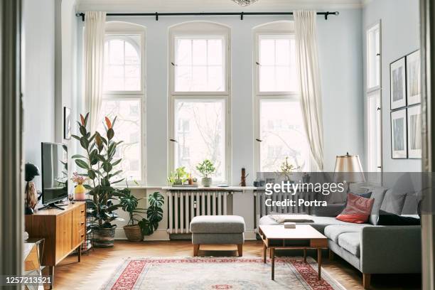 interior of living room with furniture - window stock pictures, royalty-free photos & images