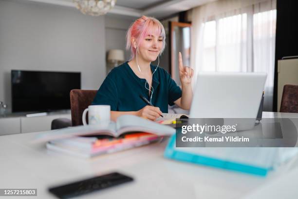 young women studying at home during pandemic isolation - questioning stock pictures, royalty-free photos & images