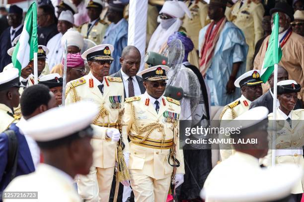Outgoing Nigerian President Muhammadu Buhari and Chief of Naval Staff, Vice Admiral Awwal Zubairu Gambo arrive at the presidential fleet review held...