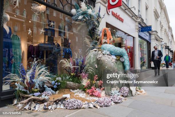 The Mermaid floral installation is displayed outside Pinko store as part of the Chelsea in Bloom floral art show in London, United Kingdom on May 22,...