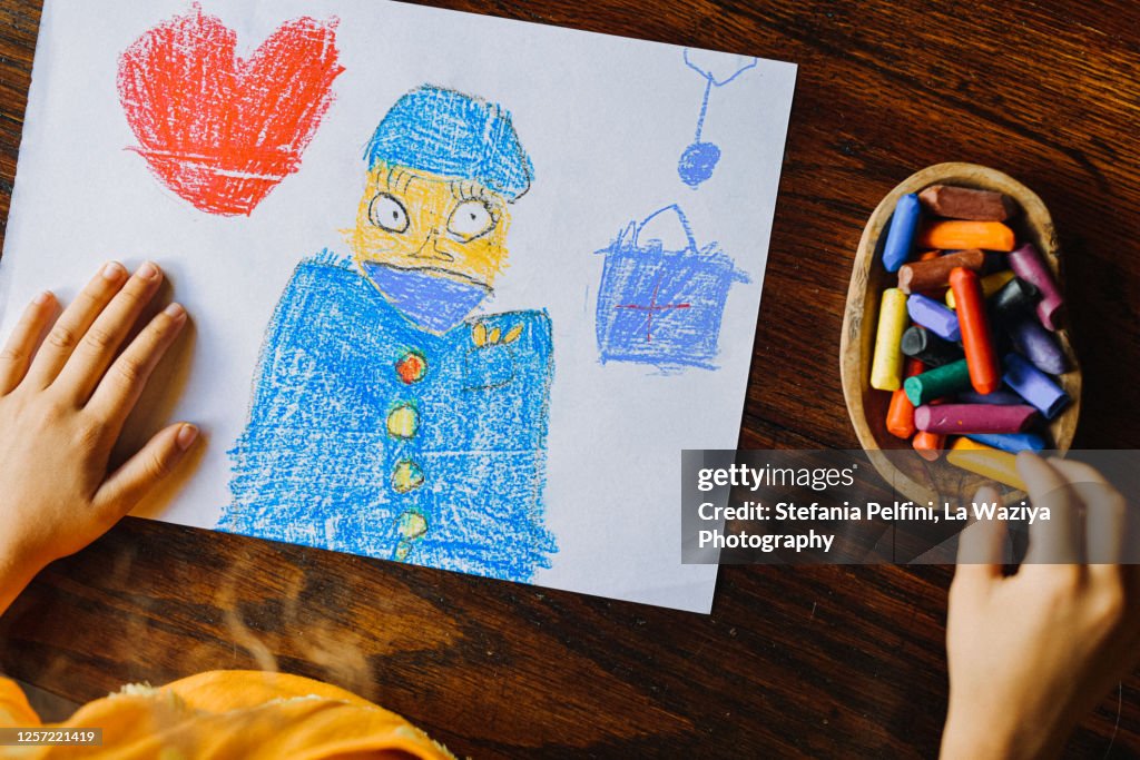 Child drawing of a doctor wearing a protective mask