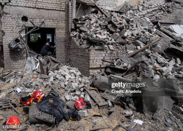 State worker observes the damage at a building that housed a fire station and a laboratory that was struck overnight in a round of fresh strikes in...