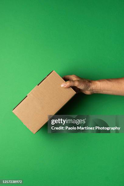People Holding Box Hands Holding Moving Box Photos and Premium High Res Pictures - Getty ...