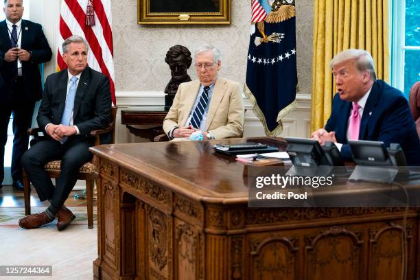 President Donald Trump talks to reporters while hosting House Minority Leader Kevin McCarthy , Senate Majority Leader Mitch McConnell and members of...