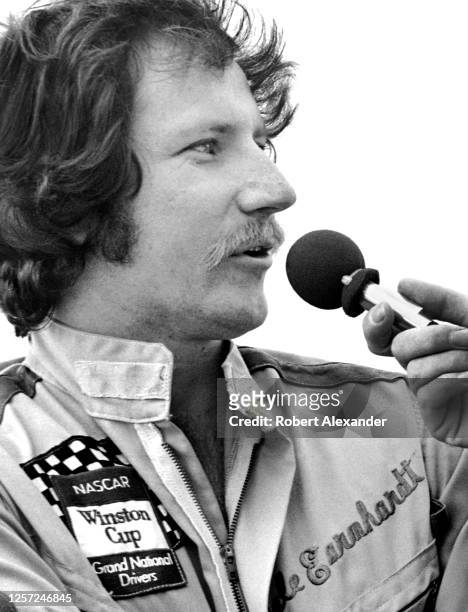 Driver Dale Earnhardt Sr. Is interviewed prior to the start of the 1980 Daytona 500 stock car race at Daytona International Speedway in Daytona...