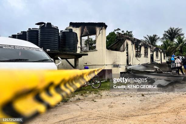 View of the school dormitory that caught fire and left at least 19 people dead in Mahdia, Guyana on May 22, 2023. At least 19 people, most of them...