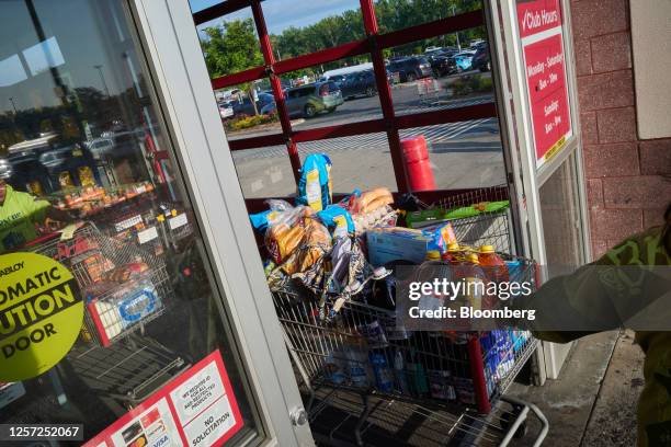 Shoppers exit a BJ's Wholesale Club location in the Queens borough of New York, US, on Friday, May 19, 2023. BJ's Wholesale Club Holdings Inc. Is...