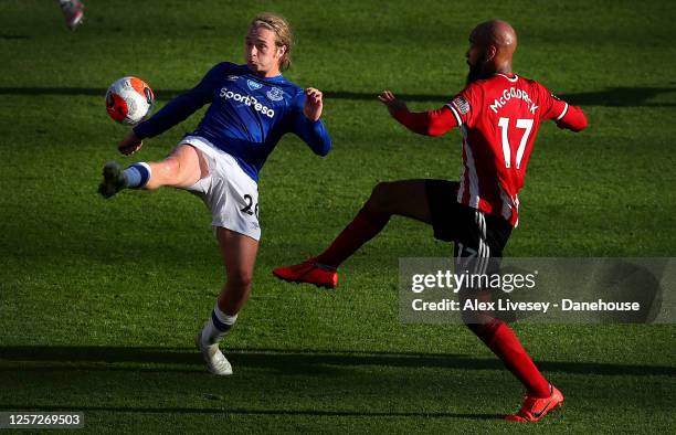 Tom Davies of Everton wins the ball from David McGoldrick of Sheffield United during the Premier League match between Sheffield United and Everton FC...