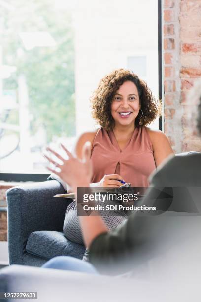 attentive therapist listening to client - mental health professional stock pictures, royalty-free photos & images