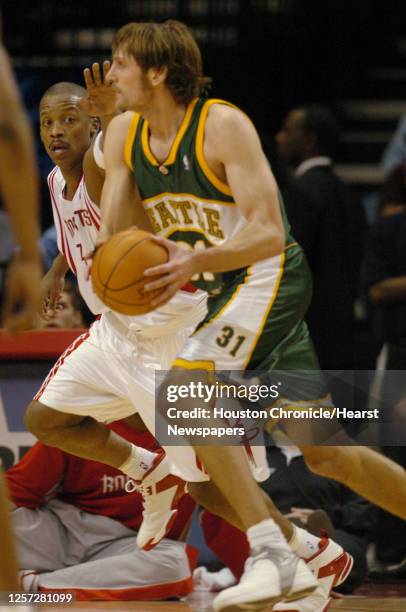 Houston's SteveFrancis guards Seattle's, Brent Barry as he looks to pass the ball, during the first half of the Houston Rockets-Seattle SuperSonics...