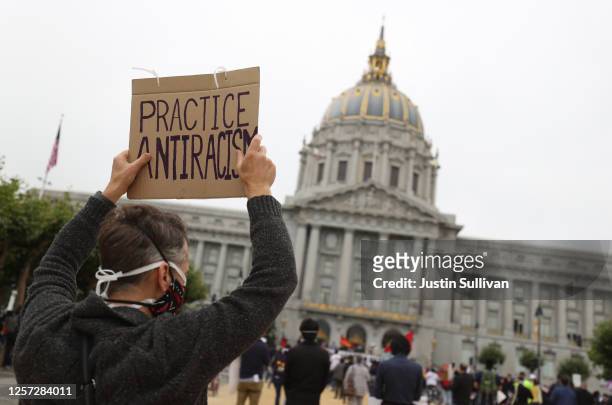 Protester holds a sign during a Strike For Black Lives demonstration outside of San Francisco City Hall on July 20, 2020 in San Francisco,...