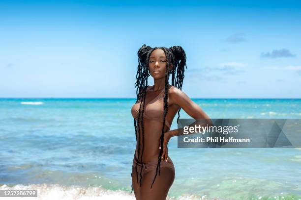tropical beach elegant black dreadlock queen - beautiful black women in bathing suits stock pictures, royalty-free photos & images