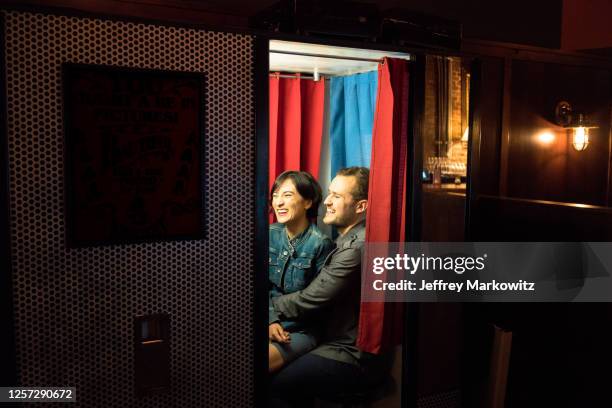 couple taking photos in photo booth - photo booth couple stock pictures, royalty-free photos & images