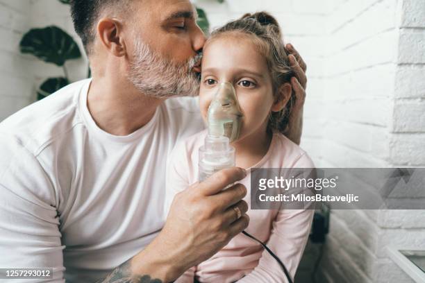 oxygen inhalation mask - respiratory disease stock pictures, royalty-free photos & images