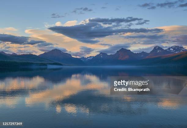 sunset in the beautiful natural scenery of glacier national park's lake mcdonald area during the summer in montana, usa. - romantic sky stock pictures, royalty-free photos & images