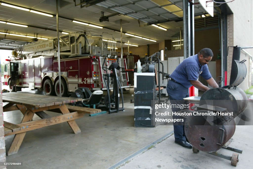 Gerald Cook Firefighter/EMT Gerald Cook checks on the progress of his pork... News ...