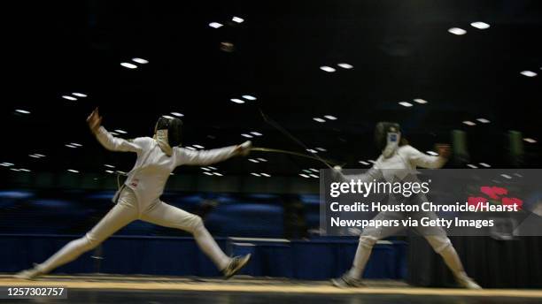 Anna Garina, of Wayne State, left, fences against Amy Orlando, right, of Notre Dame in the gold medal bout of the Women's Epee, during the 2005 NCAA...