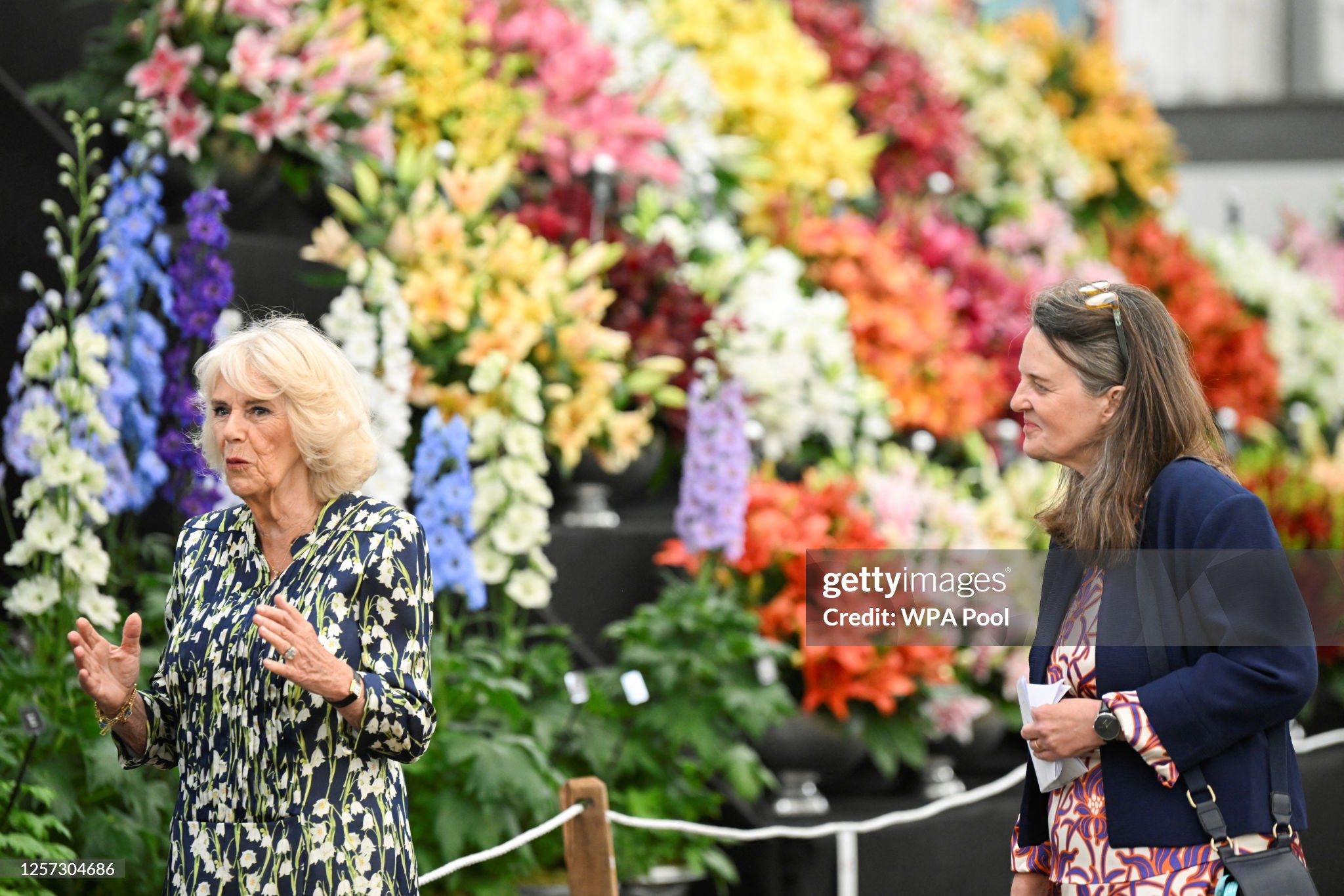 britains-queen-camilla-walks-with-clare-matterson-director-general-of-the-royal-horticultural.jpg