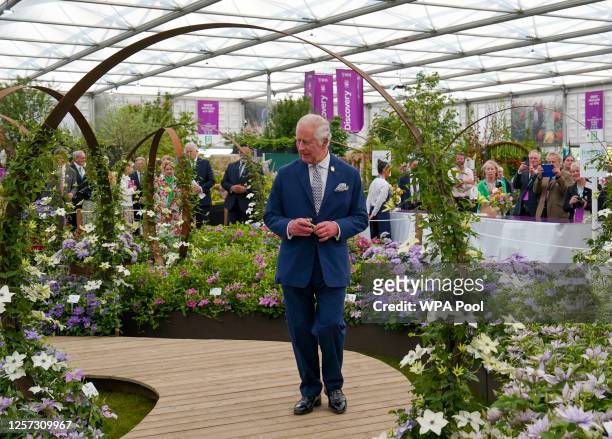 Britain's King Charles III visits the Raymond Evison Clematis stand at the Chelsea Flower Show, at the Royal Hospital Chelsea on May 22, 2023 in...