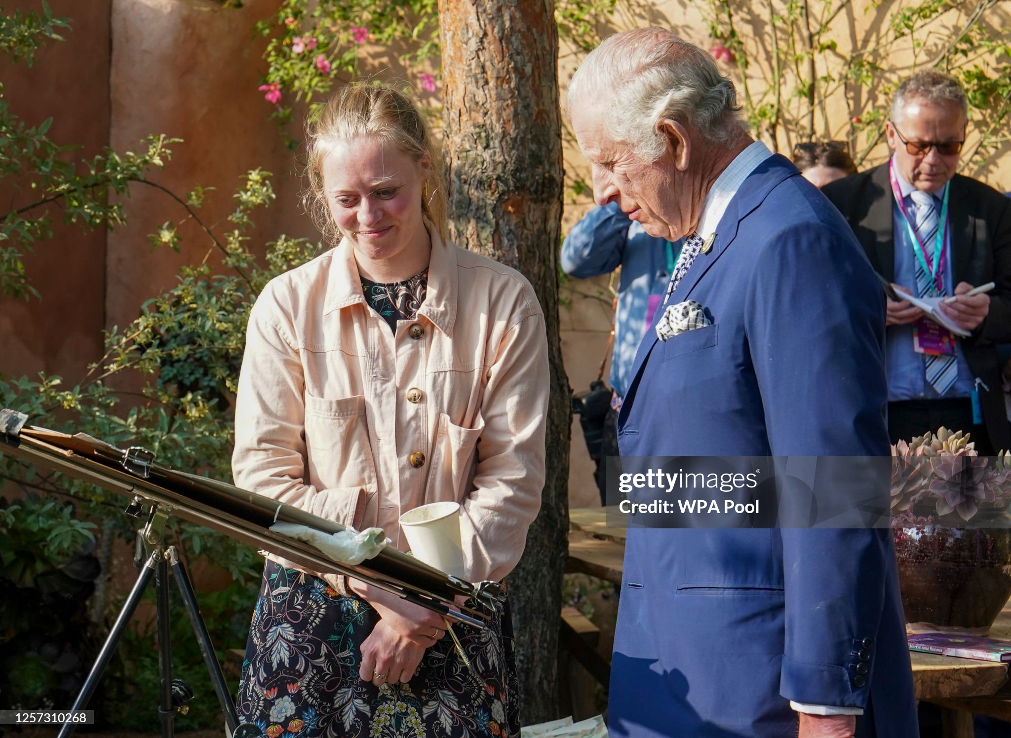 britains-king-charles-iii-with-artist-beatrice-hasell-mccosh-at-the-nature-landscape-garden.jpg