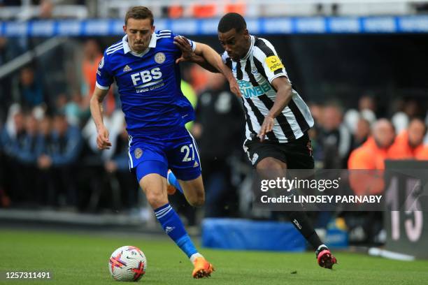 Leicester City's Belgian defender Timothy Castagne fights for the ball with Newcastle United's Swedish striker Alexander Isak during the English...