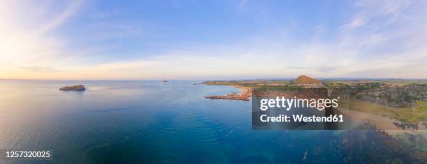 uk, scotland, north berwick, drone view of firth of forth and coastal town in summer - north berwick stock pictures, royalty-free photos & images