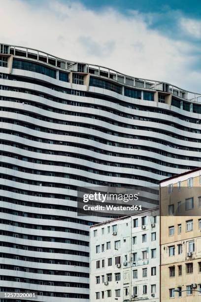 georgia, adjara, batumi, old residential buildings with wavy apartment block in background - ajaria stock pictures, royalty-free photos & images