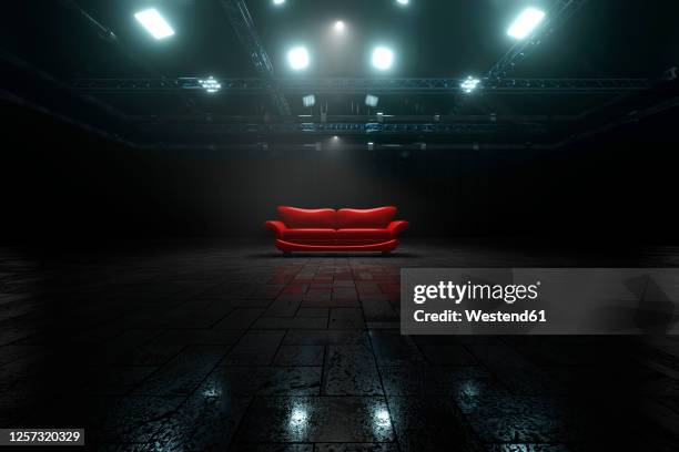 three dimensional render of red sofa inside dark warehouse - industrial building stock illustrations