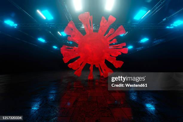 three dimensional render of giant coronavirus cell inside dark warehouse - dark warehouse stock illustrations