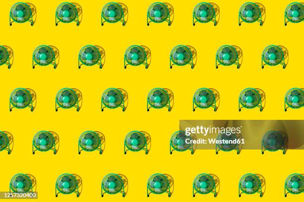 stockillustraties, clipart, cartoons en iconen met green electricfans against yellow background - elektrische ventilator