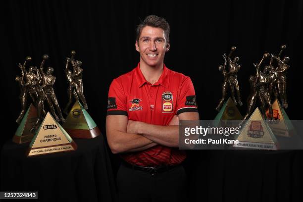 Perth Wildcats Captain Damian Martin poses with his 6 NBL Championship Trophies after announcing his retirement during a Perth Wildcats NBL media...