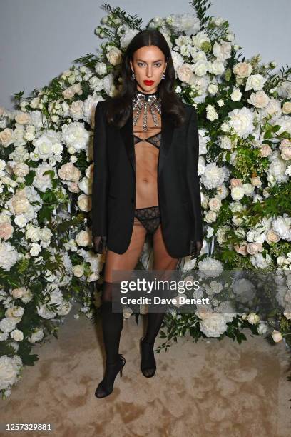 Irina Shayk attends a party hosted by British Vogue and Chopard to celebrate the Cannes Film Festival at Hotel Martinez on May 22, 2023 in Cannes,...