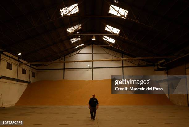 Diego Rodriguez, production manager of the Andalusian rice cooperative, Arrozua, walks in a rice warehouse on May 22, 2023 in Isla Mayor, Spain. An...