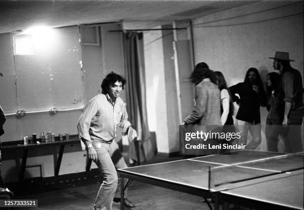 Bill Graham, rock concert promoter, playing ping pong backstage at the Fillmore Auditorium in San Francisco, 1972.