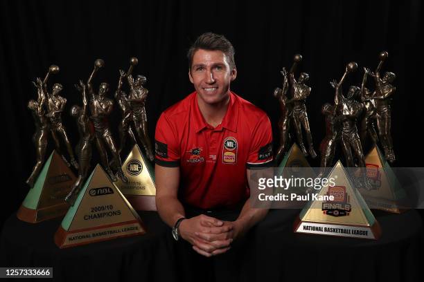 Damian Martin poses with his six NBL Championship trophies after announcing his retirement during a Perth Wildcats NBL media opportunity at the...