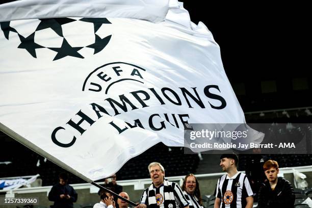 Fan of Newcastle United walks around with a UEFA Champions League flag during the Premier League match between Newcastle United and Leicester City at...