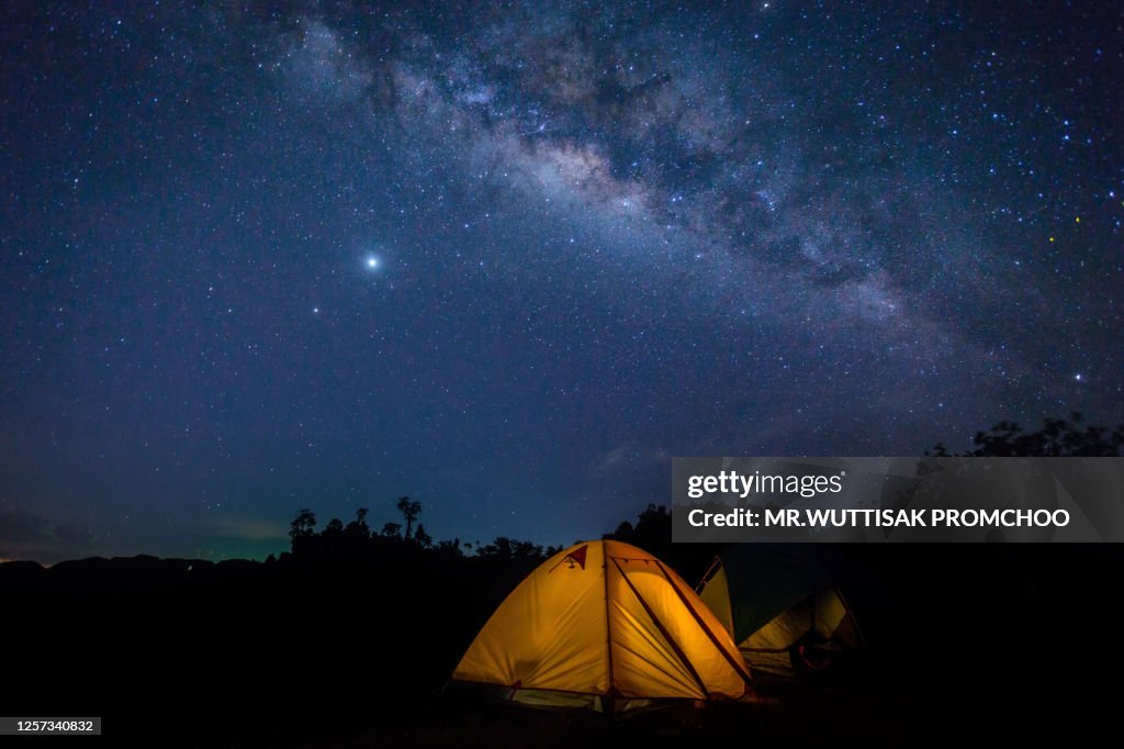 Tent camping on Mountains at Night.Milky Way.Beautiful night sky with stars.