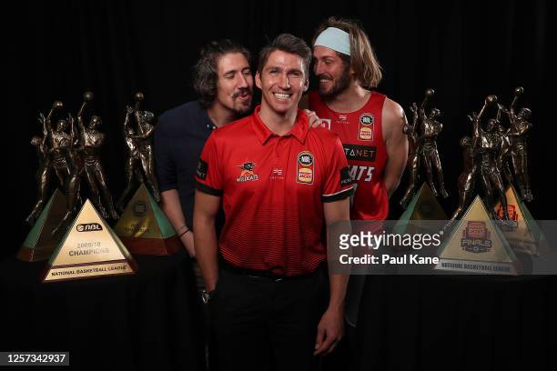 Damian Martin poses with his six NBL Championship trophies together with Greg Hire and Jesse Wagstaff after announcing his retirement during a Perth...