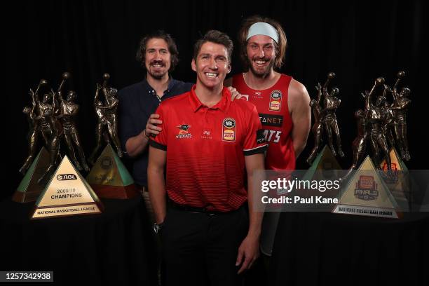 Damian Martin poses with his six NBL Championship trophies together with Greg Hire and Jesse Wagstaff after announcing his retirement during a Perth...