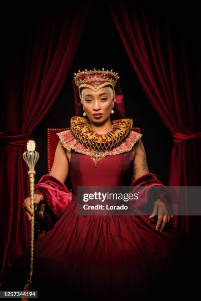 historical mixed race queen character on the throne - tudor women stock pictures, royalty-free photos & images