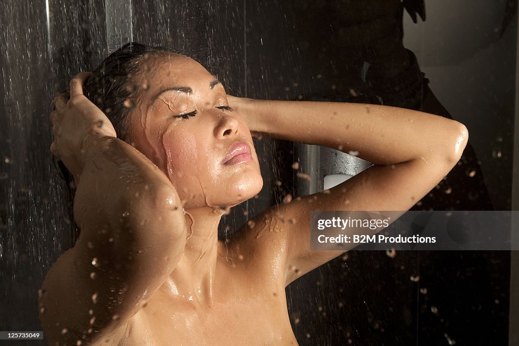 Young woman in shower