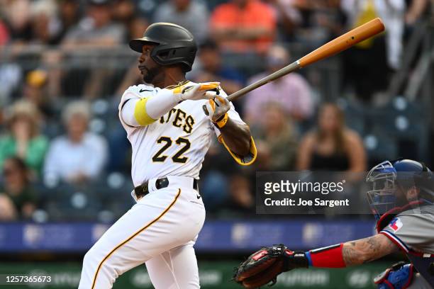Andrew McCutchen of the Pittsburgh Pirates hits a single during the first inning of the game between the Texas Rangers and the Pittsburgh Pirates at...
