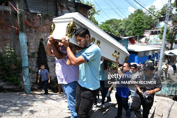 Relatives and friends carry the coffin of Leslie Ferman Murcia a victim of a stampede at the Cuscatlan stadium during a Salvadoran First Division...