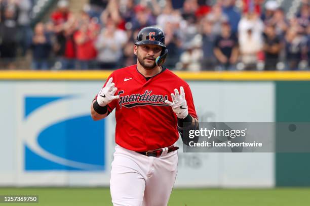 Cleveland Guardians catcher Mike Zunino rounds the bases after hitting a 2-run home run during the seventh inning of the Major League Baseball game...