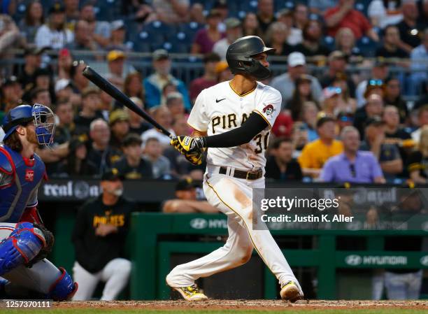 Tucupita Marcano of the Pittsburgh Pirates hits a grand slam home run in the seventh inning against the Texas Rangers during inter-league play at PNC...