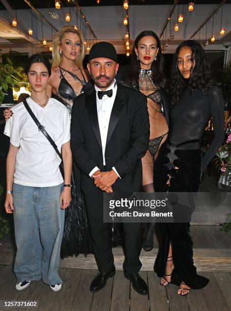Stella Maxwell, Riccardo Tisci, Irina Shayk and Mona Tougaard attend a party hosted by British Vogue and Chopard to celebrate the Cannes Film...