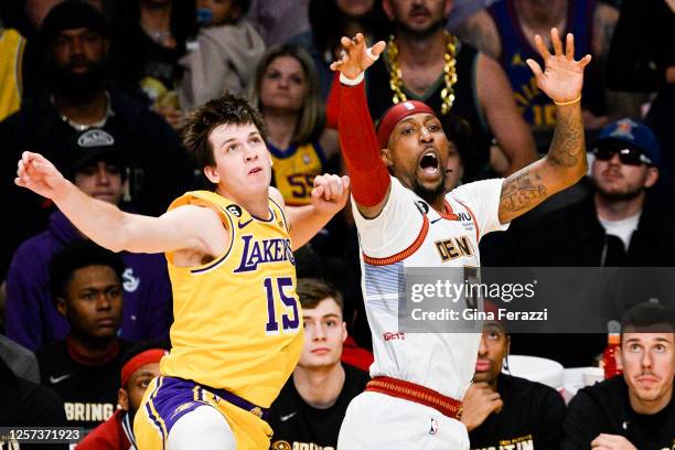 Los Angeles Lakers guard Austin Reaves, left, fouls Denver Nuggets guard Kentavious Caldwell-Pope on a three-point shot during the first quarter of...