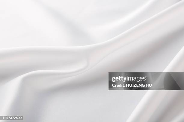 white silk background. close-up - white textile stock pictures, royalty-free photos & images